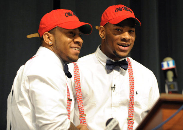 Grayson (Ga.) High defensive end Robert Nkemdiche, right, the nation's top recruit, is congratulated by his brother Denzel during Robert Nkemdiche's announcement to play college football for Ole Miss during a signing ceremony Wednesday, Feb. 6, 2013. (David Tulis/AP Photo)