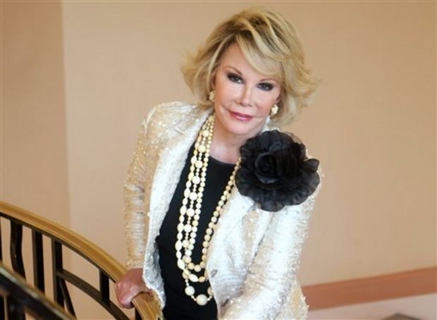 This Oct. 5, 2009 file photo shows Joan Rivers posing as she presents "Comedy Roast with Joan Rivers " during the 25th MIPCOM (International Film and Programme Market for TV, Video, Cable and Satellite) in Cannes, southeastern France. Rivers, the raucous, acid-tongued comedian who crashed the male-dominated realm of late-night talk shows and turned Hollywood red carpets into danger zones for badly dressed celebrities, died Thursday, Sept. 4, 2014. She was 81. Rivers was hospitalized Aug. 28, after going into cardiac arrest at a doctor's office. (AP Photo/Lionel Cironneau, File)