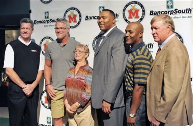 Mississippi Sports Hall of Fame and Museum Class of 2015 inductees, from left to right, Steve Knight, Brett Favre, Gwen White, Clarence Weatherspoon, Fred McAfee and Mike Dennis pose for photographs after being introduced Thursday, Sept. 25, 2014, in Jackson, Miss. (AP Photo/The Clarion-Ledger, Greg Jenson)