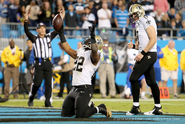 New Orleans Saints running back Mark Ingram (22) and quarterback Drew Brees celebrate after Ingram scores on a second quarter run during the game between the New Orleans Saints and Carolina Panthers at the Bank of America Stadium in Charlotte on Thursday, October 30, 2014. (Michael DeMocker, Nola.com / The Times-Picayune)