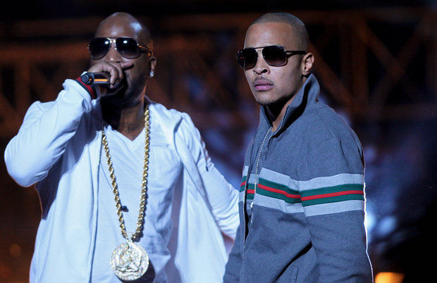This Oct. 1, 2011, file photo shows Rapper T.I., right, and Young Jeezy, left, performing during the BET Hip Hop Awards in Atlanta. Two people suffered non-life-threatening injuries after being shot Saturday, Feb. 28, 2015, at a Charlotte nightclub where rappers T.I., Young Jeezy and Yo Gotti were advertised to appear, police say. (AP Photo/David Goldman, File)
