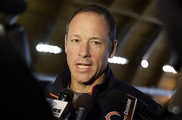 Aaron Kromer talks to reporters during the team's NFL football minicamp at Halas Hall in Lake Forest, Ill. Buffalo Bills President Russ Brandon says offensive line coach Aaron Kromer has been put on paid administrative leave after being accused of punching a boy in the face for using his beach chairs. Kromer joined the team in January after being fired from the Chicago Bears. (AP Photo/Nam Y. Huh)