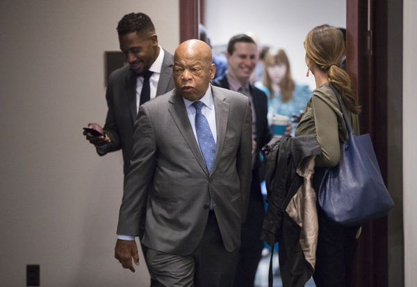 In this Nov. 29, 2017, file photo, Rep. John Lewis, D-Ga., and other members of the House Democratic Caucus leave a meeting on Capitol Hill in Washington. Lewis will speak at the Mississippi Civil Rights Museum, months after refusing to join President Donald Trump there. A private group called Friends of Mississippi Civil Rights Inc. announced Tuesday, Jan. 16, that it will give an award to Lewis, who helped lead the historic 1965 march across the Edmund Pettus Bridge in Selma, Ala. AP Photo/J. Scott Applewhite, File