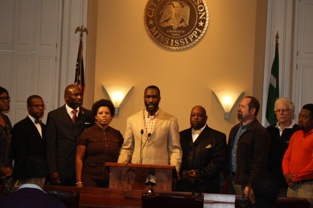 Ward 6 City Councilman Tony Yarber speaks at the press conference, flanked by pastors, ministers and community leaders.
