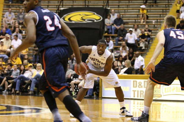 Jeremiah Eason (30) looks for a teammate with Kaj-Bjorn Sherman (45) and Phillip Jones (24) defending during Conference USA basketball action at Reed Green Coliseum in Hattiesburg on Thursday. (Patrick Lowery / gulflive.com)