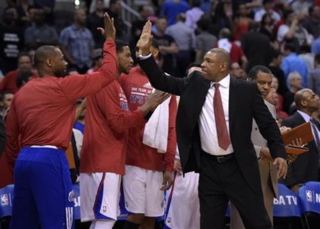 Los Angeles Clippers head coach Doc Rivers, right, congratulates members of his team during the second half in Game 5 of an opening-round NBA basketball playoff series against the Golden State Warriors, Tuesday, April 29, 2014, in Los Angeles. The Clippers won 113-103. (AP Photo)