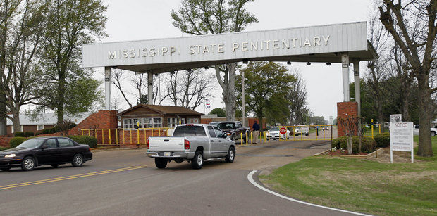 Traffic passes to and from the entrance of the Mississippi State Penitentiary in Parchman, Mississippi. The facility was built in 1901, and inmates claim the aging prison has unsanitary and unhealthy living conditions. (AP Photo/Rogelio V. Solis)