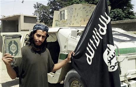 This undated image made available in the Islamic State's English-language magazine Dabiq, shows Belgian Abdelhamid Abaaoud. . Abaaoud the Belgian jihadi suspected of masterminding deadly attacks in Paris was killed in a police raid on a suburban apartment building, the city prosecutor's office announced Thursday Nov. 1, 2015. Paris Prosecutor Francois Molins' office said 27-year-old Abdelhamid Abaaoud was identified based on skin samples. His body was found in the apartment building targeted in the chaotic and bloody raid in the Paris suburb of Saint-Denis on Wednesday. (Militant photo via AP)