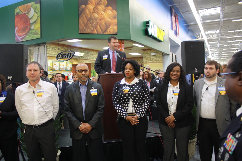 Lee Maddox, store manager of Byram’s new Walmart Supercenter, presents members of the store’s management team Wednesday morning during the grand opening. Photo by Shanderia K. Posey
