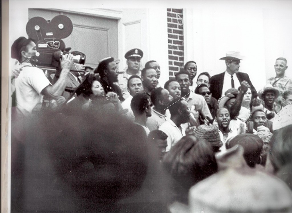 Brown-Wright is shown on the Madison County Courthouse steps with Andrew Young, Dr. Martin Luther King Jr., and protesters in 1966. Photo courtesy of Cynthia Goodloe Palmer