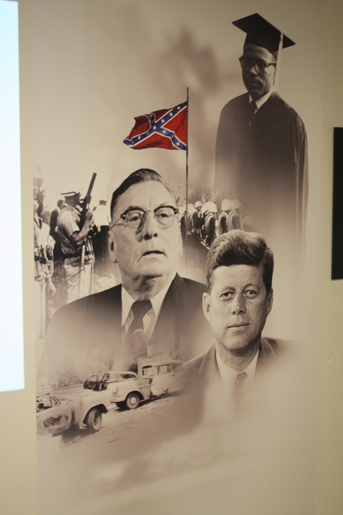 This image on display features President John F. Kennedy, former Mississippi Gov. Ross Barnett and James Meredith.
