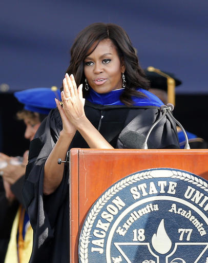 First lady Michelle Obama salutes the graduating students as she delivers the commencement address for Jackson State University's Class of 2016 at the Mississippi Veterans Memorial Stadium in Jackson, Miss., Saturday, April 23, 2016. (AP Photo/Rogelio V. Solis)