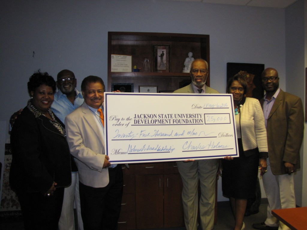 Displaying JSU Development Foundation $25,000 Holmes Endowed Gift are (from left) Sandra Hodge, Mario Azevedo, Charles Holmes,  Evelyn Leggett, Byron Orey; (back row)  Ricky Hill, Chair, Department of Political Science. Photo by Janice K. Neal-Vincent