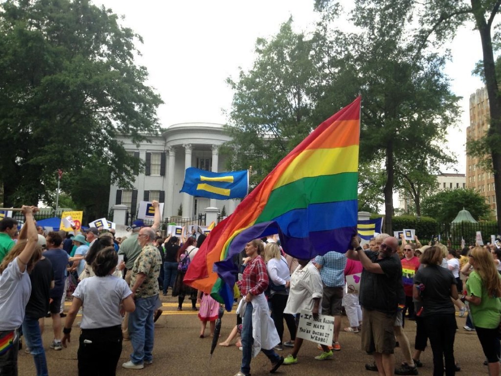 Protestors march seeking repeal of a Mississippi law allowing religious groups and some private businesses to deny services to same-sex couples, transgender people and others. More than 300 people attended a March and rally Sunday, May 1, 2016, in Jackson, Miss. (AP Photo Jeff Amy)
