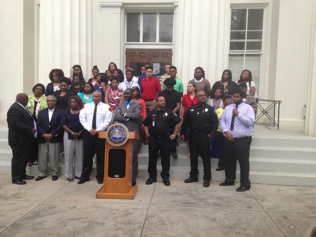 Jackson Mayor Tony Yarber and city officials stand with some of the youth working in the city’s Summer Youth Employment Program. PHOTO BY SHANDERIA K. POSEY
