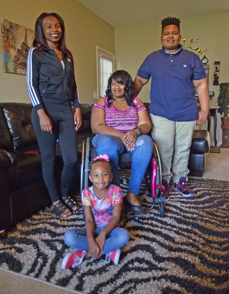 Jamecca Jones, seated, says her children have been a motivating force in her recovery. Pictured are (from left) Jaya, 16, Janique, 5, and Dravian, 12