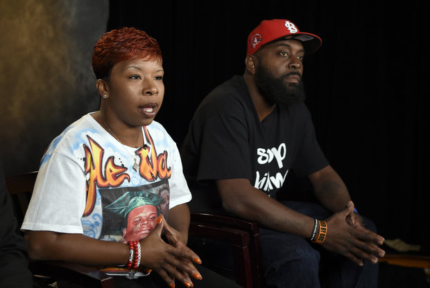  In this Sept. 27, 2014 file photo, the parents of Michael Brown, Lesley McSpadden, left, and Michael Brown, Sr., right, sit for an interview with The Associated Press in Washington. Attorneys representing Ferguson, Mo., its former police chief and an ex-officer in a wrongful-death lawsuit by Brown's parents are pressing the latest quest for access to any of the late 18-year-old's juvenile records. Anthony Gray, a Brown family attorney, has said any brush by Brown with the juvenile court system is irrelevant to whether Brown's 2014 death resulted from excessive police force. (AP Photo/Susan Walsh, File)