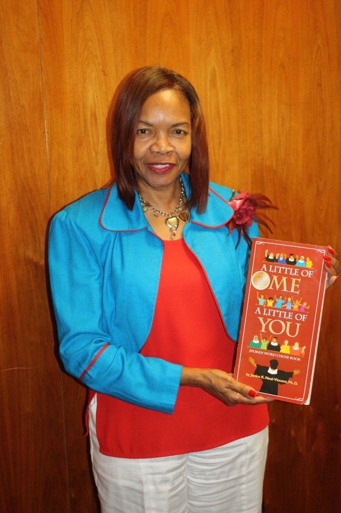 Janice K. Neal-Vincent holds her new book titled “A Little of Me: A Little of You.” 