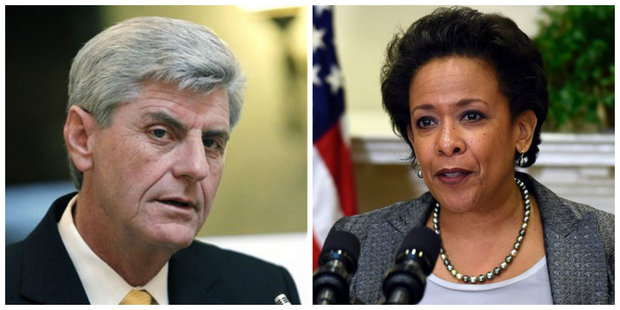 U.S. Attorney General Loretta Lynch (right) announced Thursday a lawsuit by the Department of Justice accusing the State of Mississippi of violating the Americans with Disabilities Act. Gov. Phil Bryant, however, has suggested the lawsuit is politically motivated. (AP file photos)