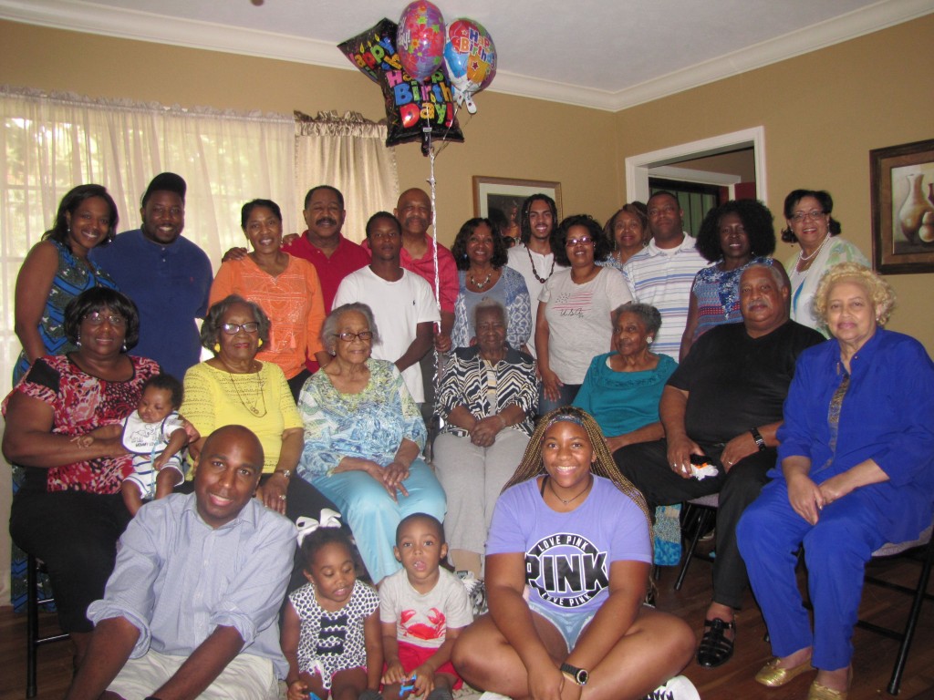 Family and friends surround Maxine Edgar Flowers, Aunt Maxine, during her 100th birthday celebration.