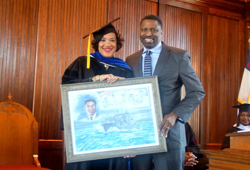 Karen Weaver is shown with Derrick Johnson, who presented her a protriat of Medger Wiley Evers and the ship named in his honor on behalf of the MS State Conference NAACP. PHOTO BY JAY JOHNSON