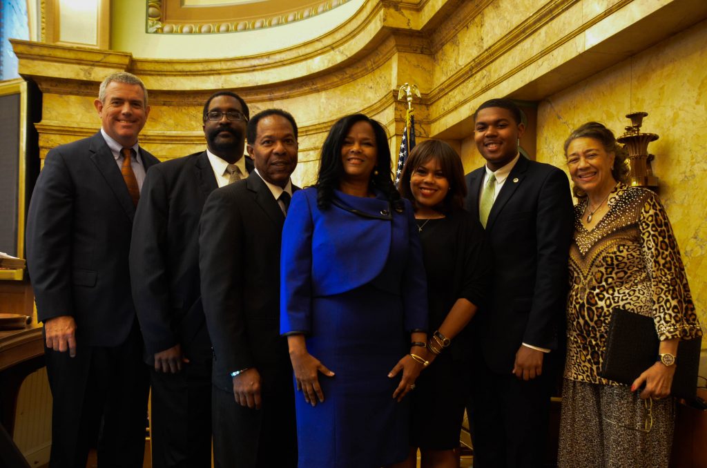 Debra Gibbs’ swearing-in ceremony included speeches from several family and friends. Pictured are (from left) Speaker of the House Philip Gunn, the Rev. Ronald Patton, Robert L. Gibbs, Debra Gibbs, Ariana Gibbs, Justis R. Gibbs II and Johnnie Patton.