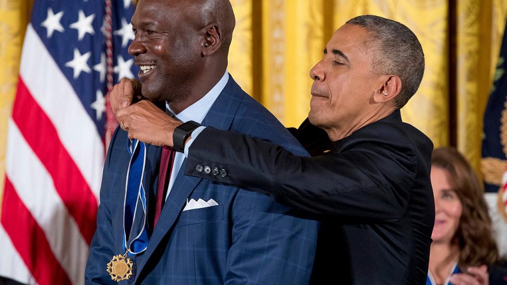 President Barack Obama presents the Presidential Medal of Freedom to former NBA basketball player Michael Jordan during a ceremony in the East Room of the White House Tuesday, Nov. 22, 2016, in Washington. Obama is recognizing 21 Americans with the nation's highest civilian award, including giants of the entertainment industry. (AP)