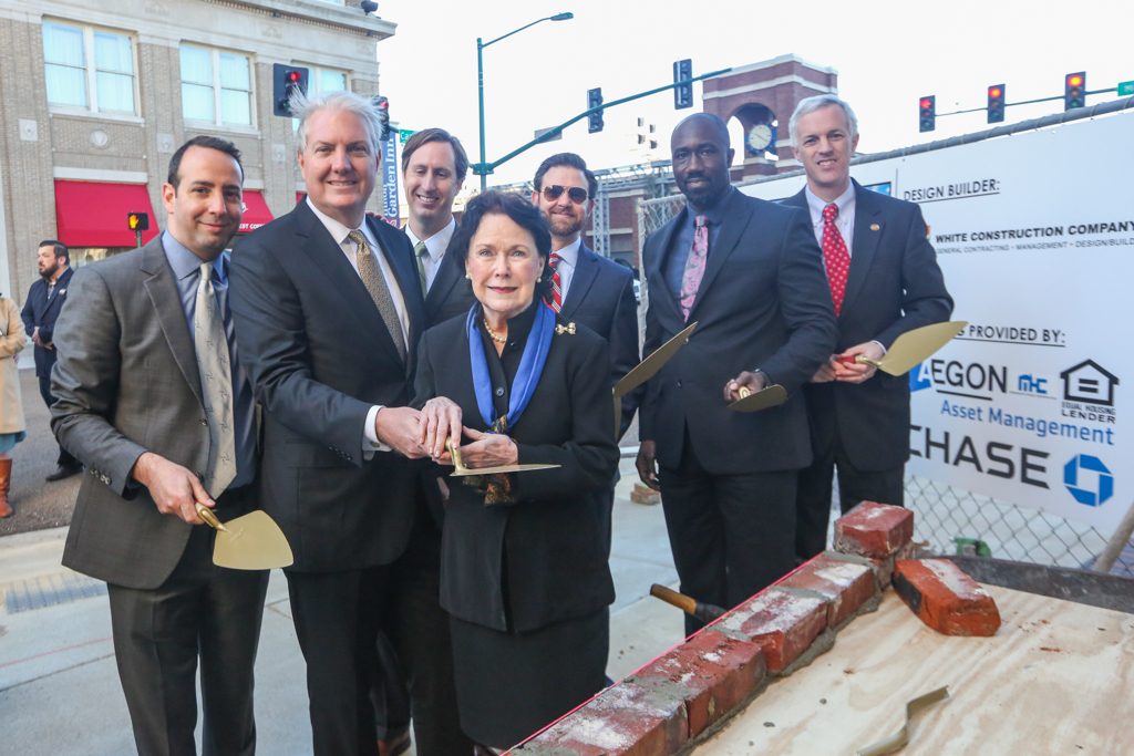 Officials at brick-laying ceremony.