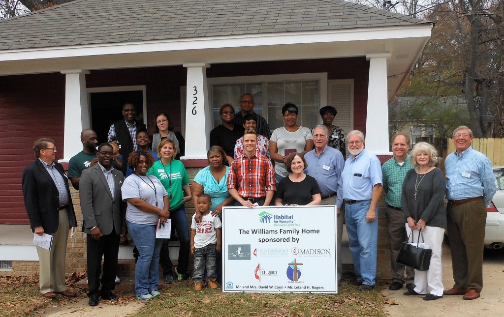 Habitat for Humanity board members, staff and volunteers dedicated the new home of Lequoya Williams on Manship Street Monday.