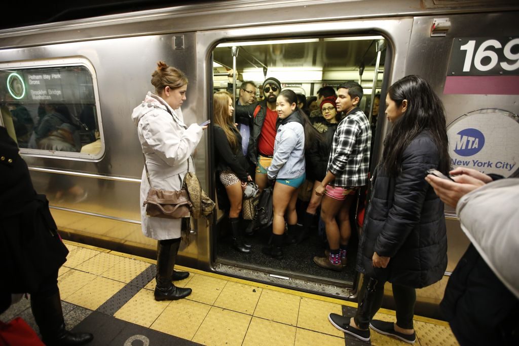 The doors of a subway train open revealing pantless riders in colorful underwear during the 15th annual No Pants Subway Ride (Kathy Willens, Associated Press)