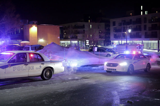 Police survey the scene after deadly shooting at a mosque in Quebec City, Canada on Sunday, Jan. 29, 2017. (Francis Vachon / AP)