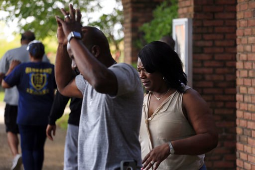 Family members react after learning that Kingston Frazier was found dead after being kidnapped during the theft of his mother's vehicle from a Kroger parking lot Thursday, May 18, 2017, in Jackson, Miss. (Elijah Baylis/The Clarion-Ledger via AP)