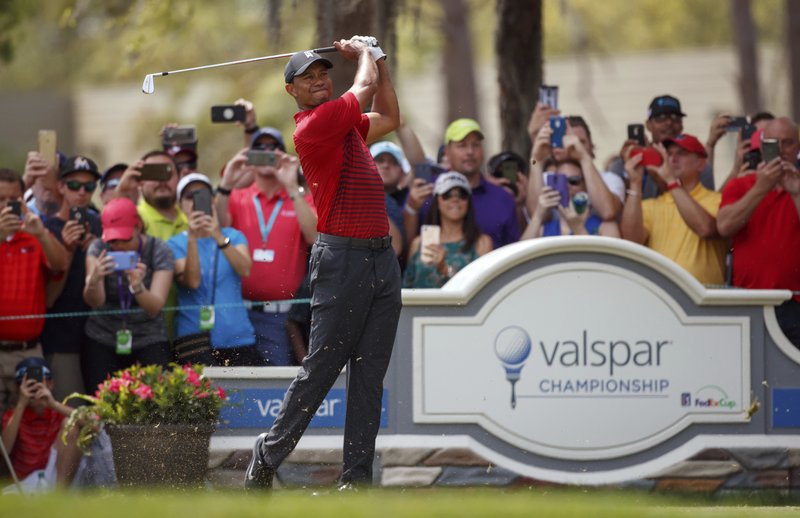 Tiger Woods plays his shot from the second tee during the final round of the Valspar Championship golf tournament Sunday, March 11, 2018, in Palm Harbor, Fla. (AP Photo/Mike Carlson)