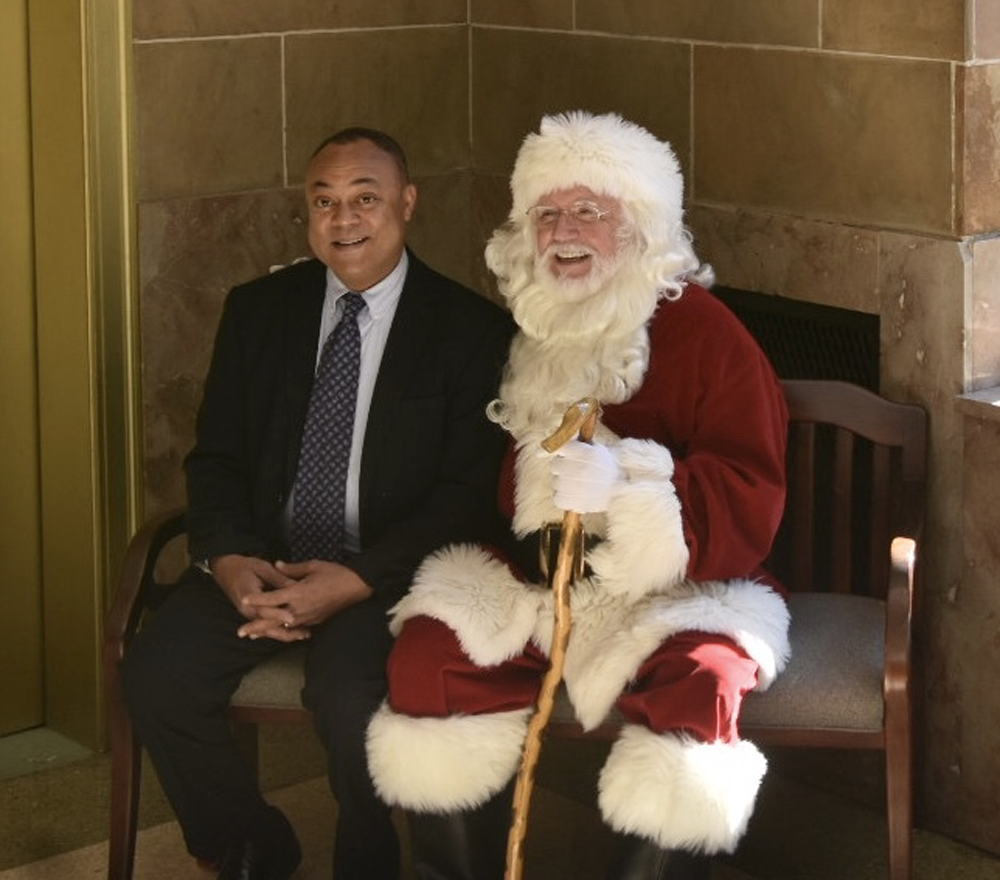 Hinds County District Attoney Robert S. Smith spreads holiday cheer with Santa.     PHOTO BY KEVIN BRADLEY