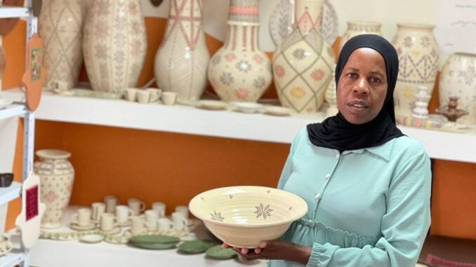 Zenab Grabia with one of her many unique artworks at her gallery in the Bedouin town of Segev Shalom. (Courtesy of Zenab Grabia)